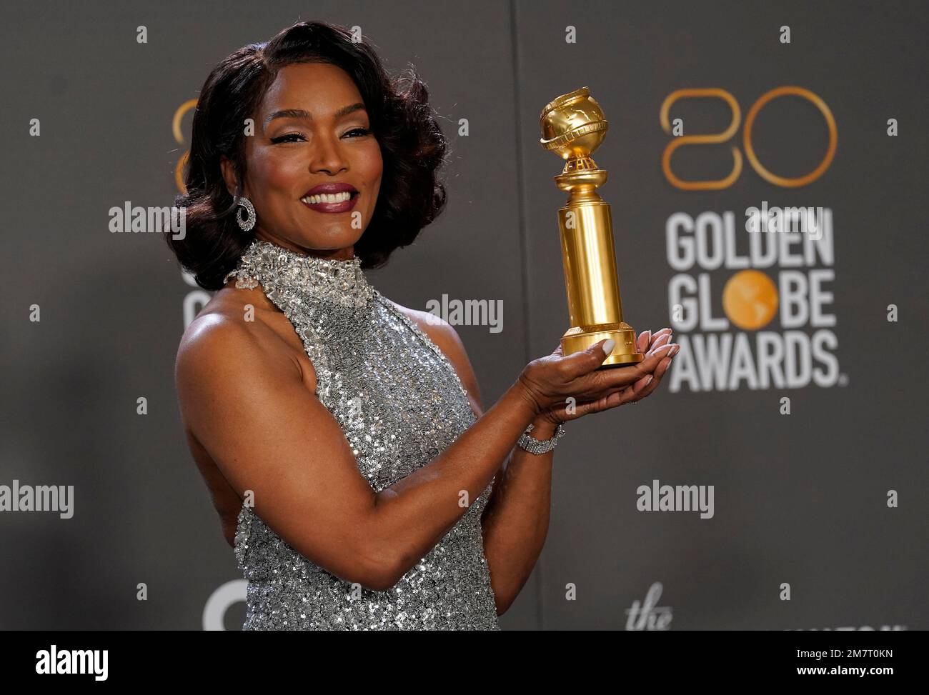 Angela Bassett poses in the press room with the award for best ...