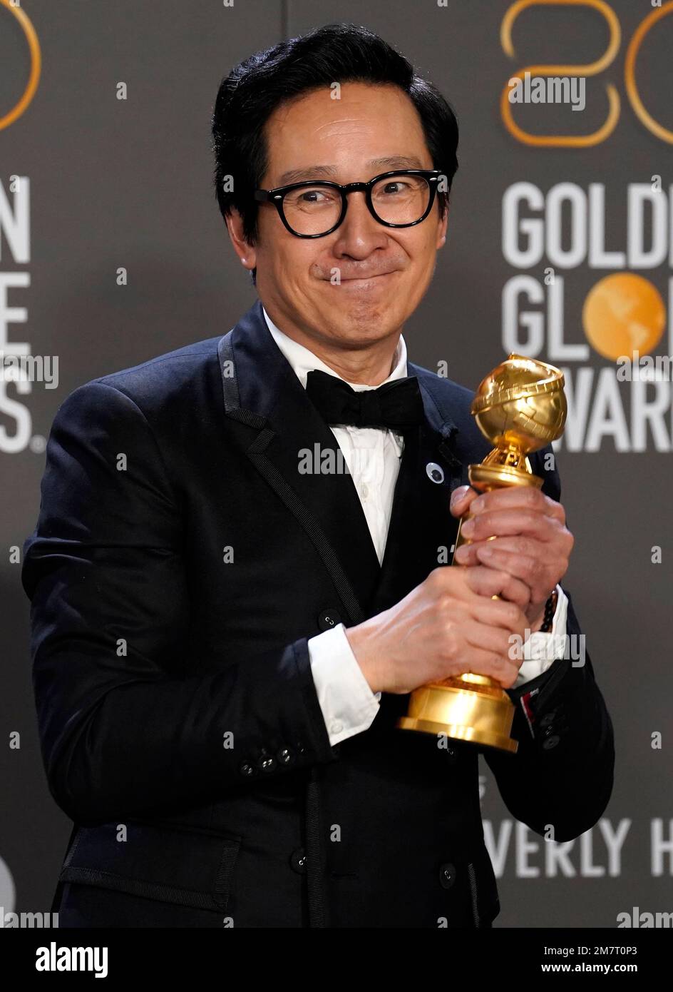 Ke Huy Quan poses in the press room with the award for best performance ...