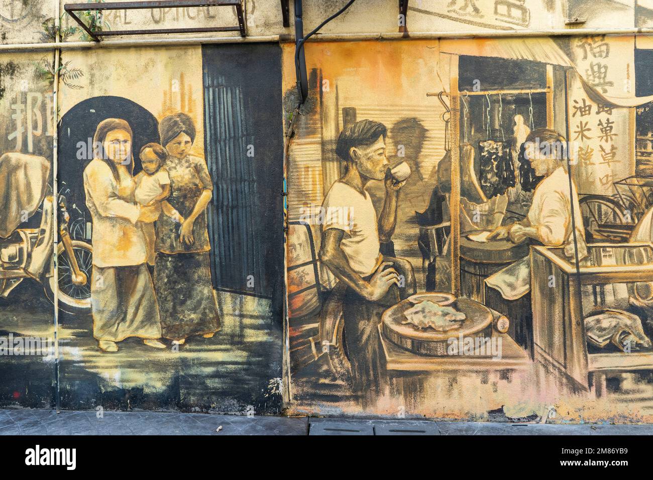 Kuala Lumpur, Malaysia - 12. Dezember 2022 : KWAI CHAI HONG, Gasse hinter der Petaling Street mit Wandmalereien, die das tägliche Leben in Chinatown darstellen Stockfoto