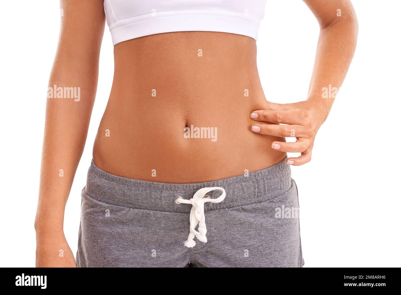 Diät, Gesundheit und Frau kneifen Magen nach Gewichtsverlust, Körpertransformation oder Fettabsaugung auf weißem Hintergrund Studio. Wellness-Lifestyle, Cellulite Stockfoto