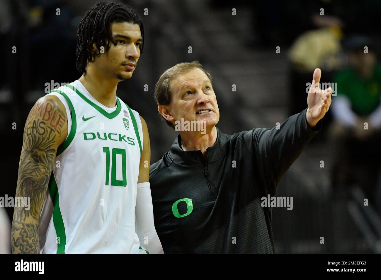 Oregon center Kel'el Ware (10) listens to Oregon head coach Dana Altman