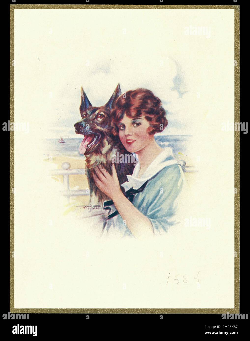 Schokoladenschachtel mit einer Dame am Meer und ihrem elsässischen Hund. Stockfoto
