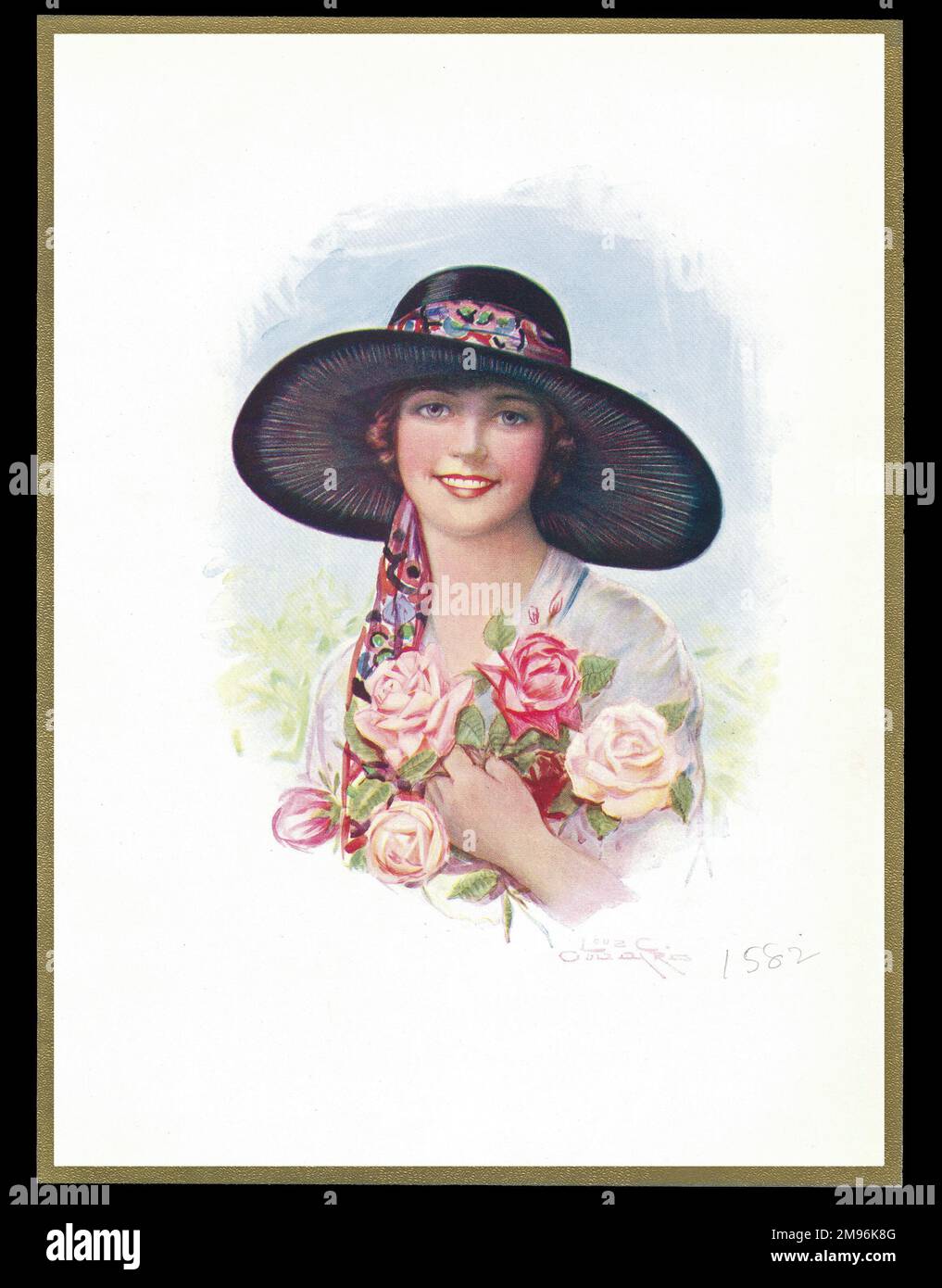 Schokoladenschachtel mit einer lächelnden Dame in einem breiträndigen Hut und Rosen in der Hand. Stockfoto