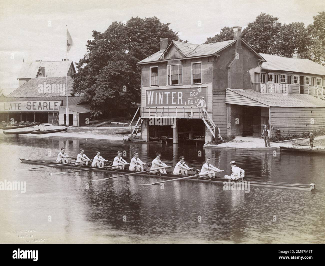 Queens' College Cambridge Ruderteam auf der River Cam, in der Nähe von Searle's Boathouse und Winter Boat Builders. Stockfoto