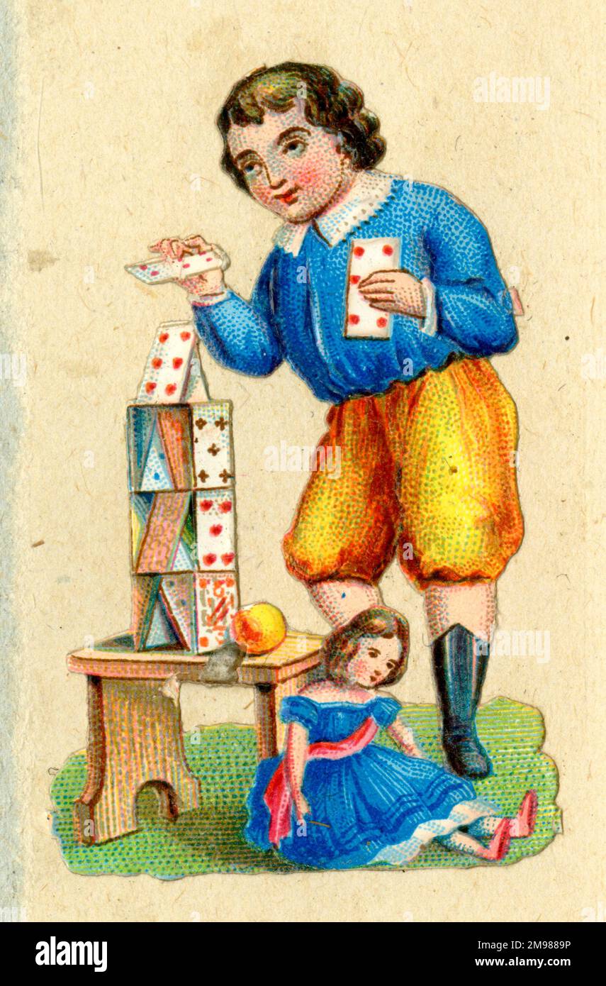 Schrott - Junge baut Kartenhaus. Stockfoto