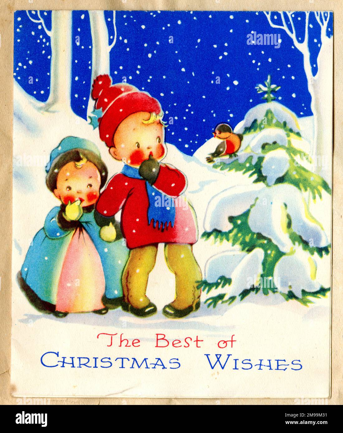Weihnachtskarte, Kinder im Schnee, die sich ein Robin ansehen. Stockfoto