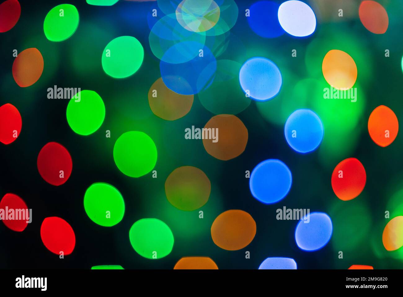 Farbenfroher abstrakter Hintergrund mit rundem Bokeh aus den hellen Lichtern Stockfoto