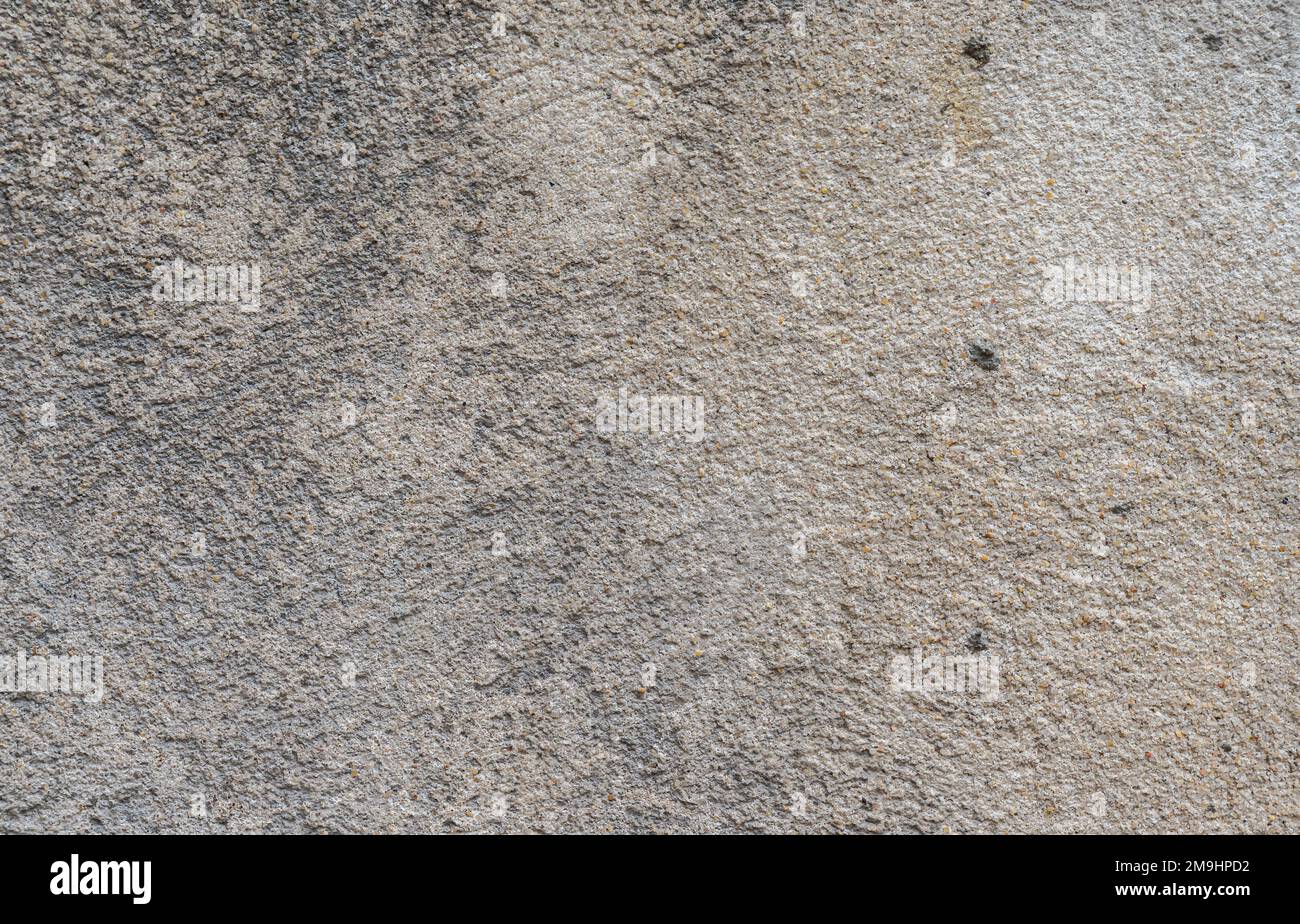 Strukturierte schmutzige Betonwand eines Hauses in der Altstadt von Avignon, Frankreich Stockfoto