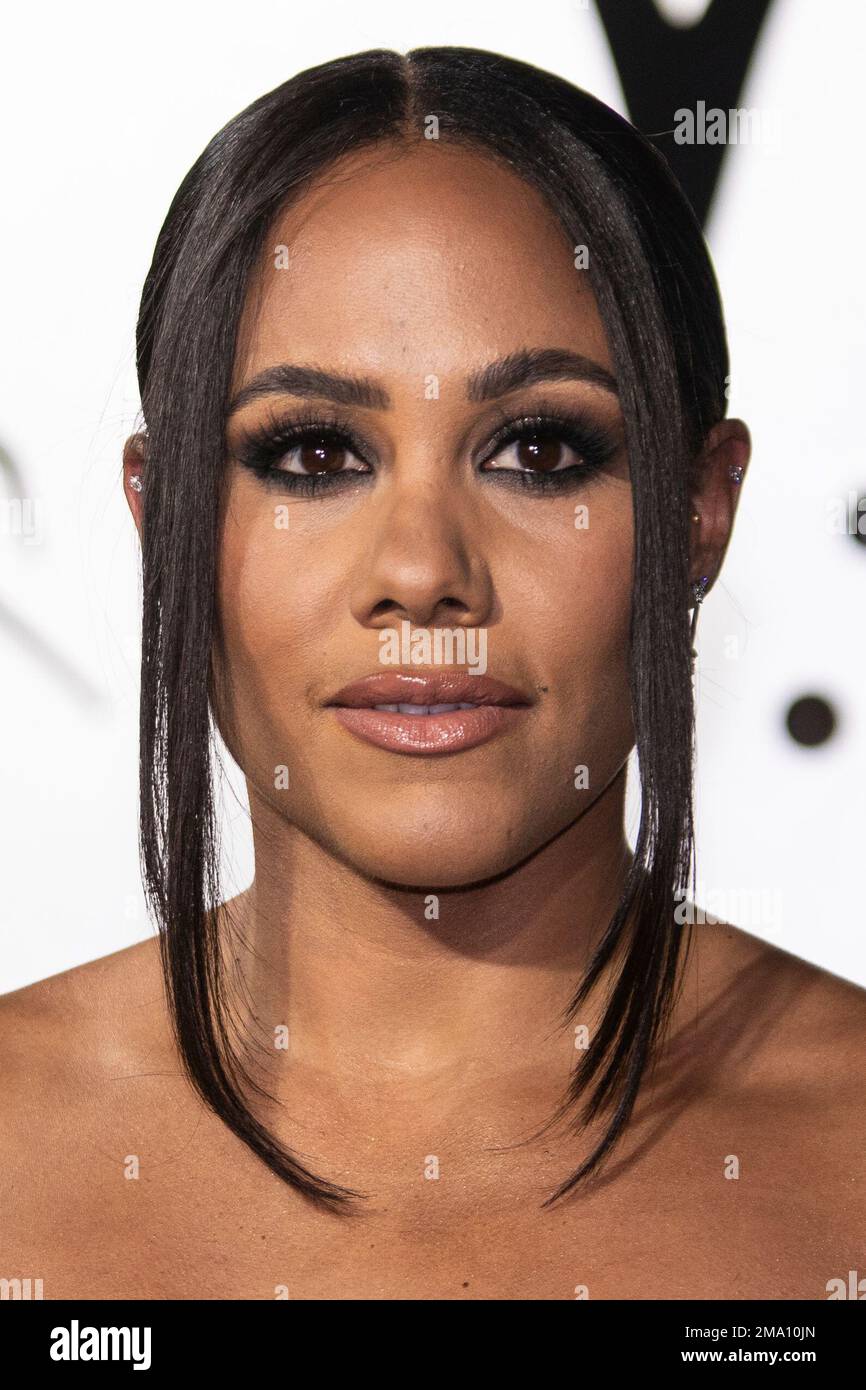 Alex Scott poses for photographers upon arrival for the premiere of the