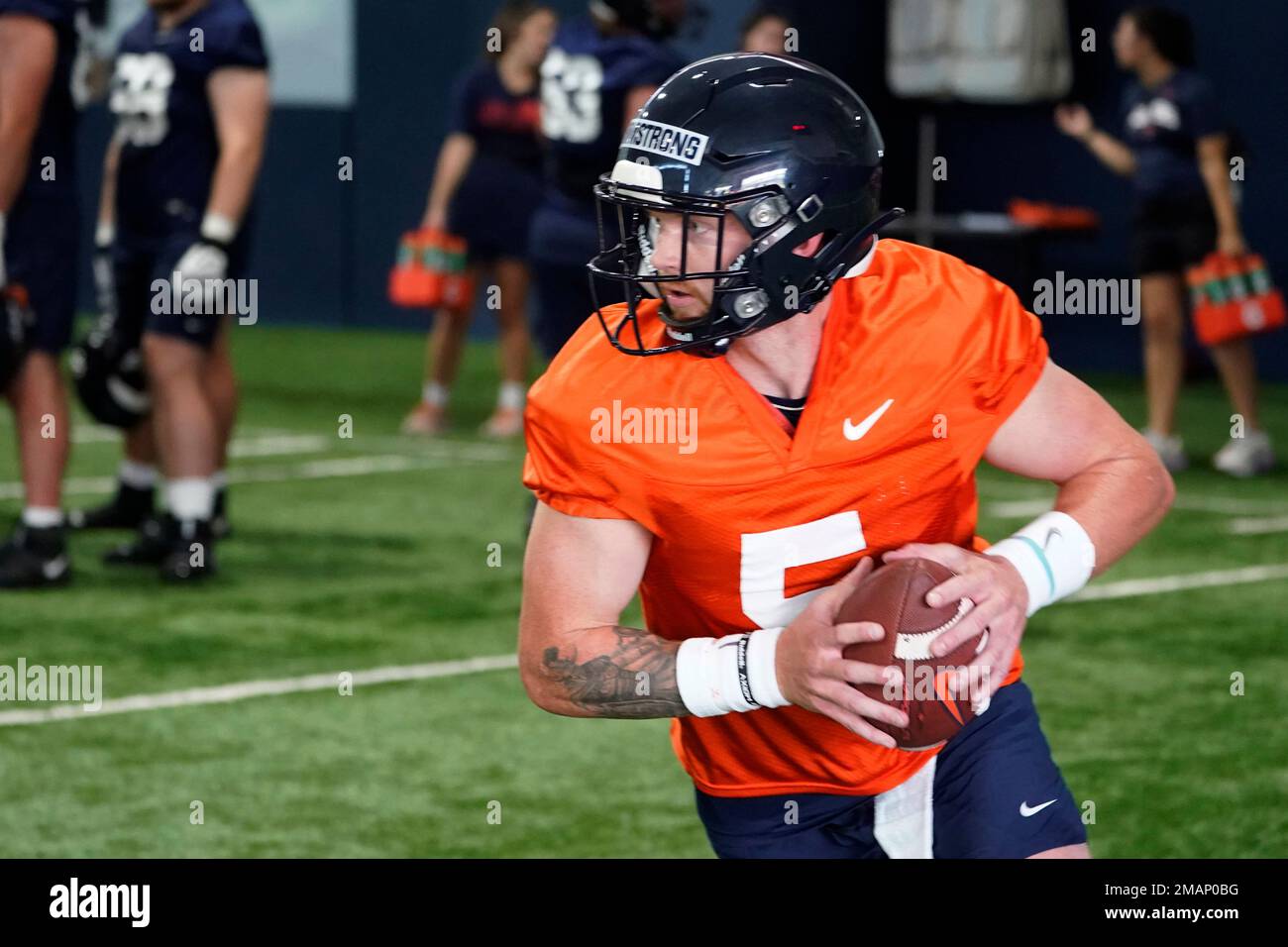 FILE Virginia quarterback Brennan Armstrong participates in drills
