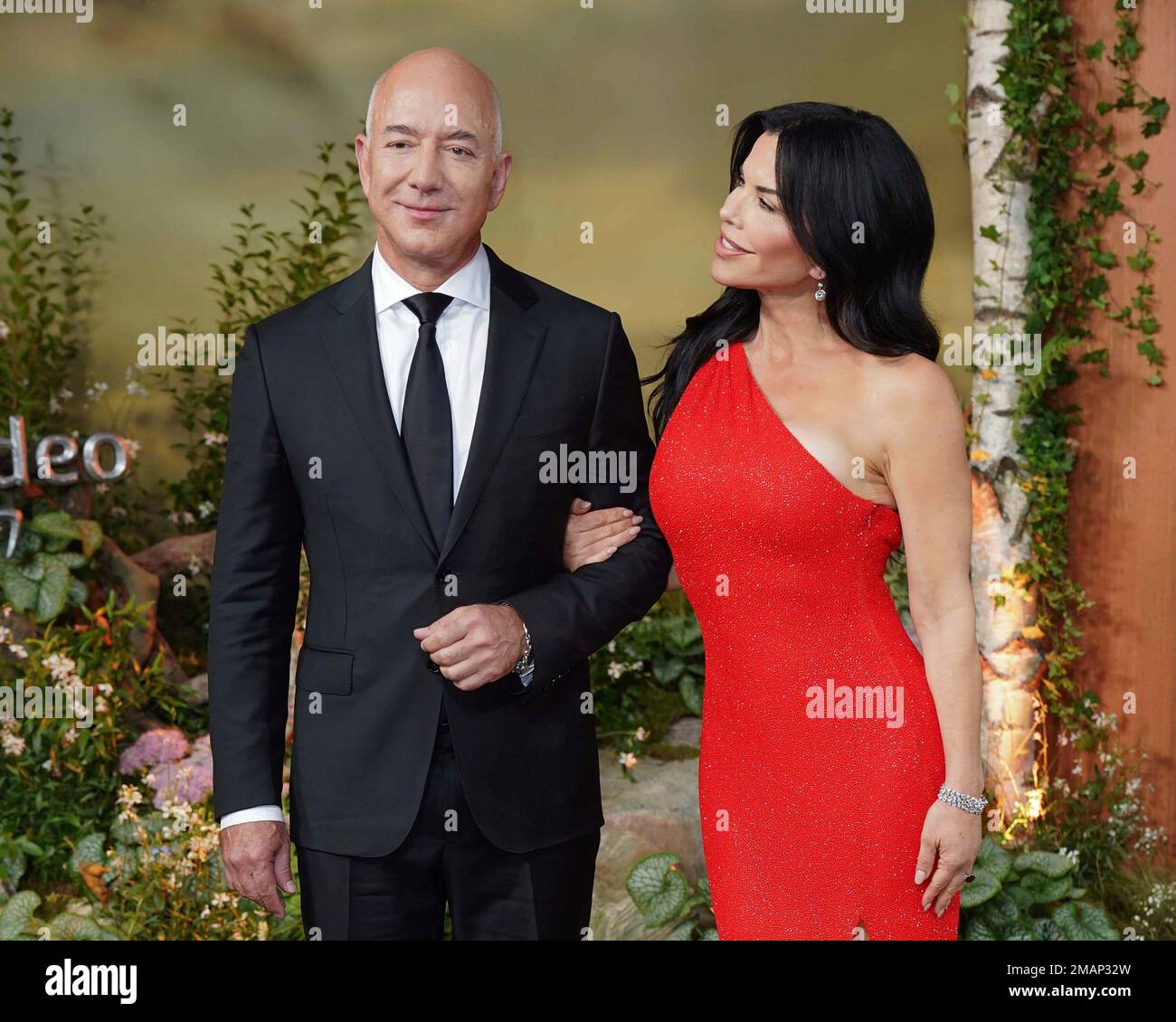 Jeff Bezos, left, and Lauren Sanchez pose for photographers upon their ...