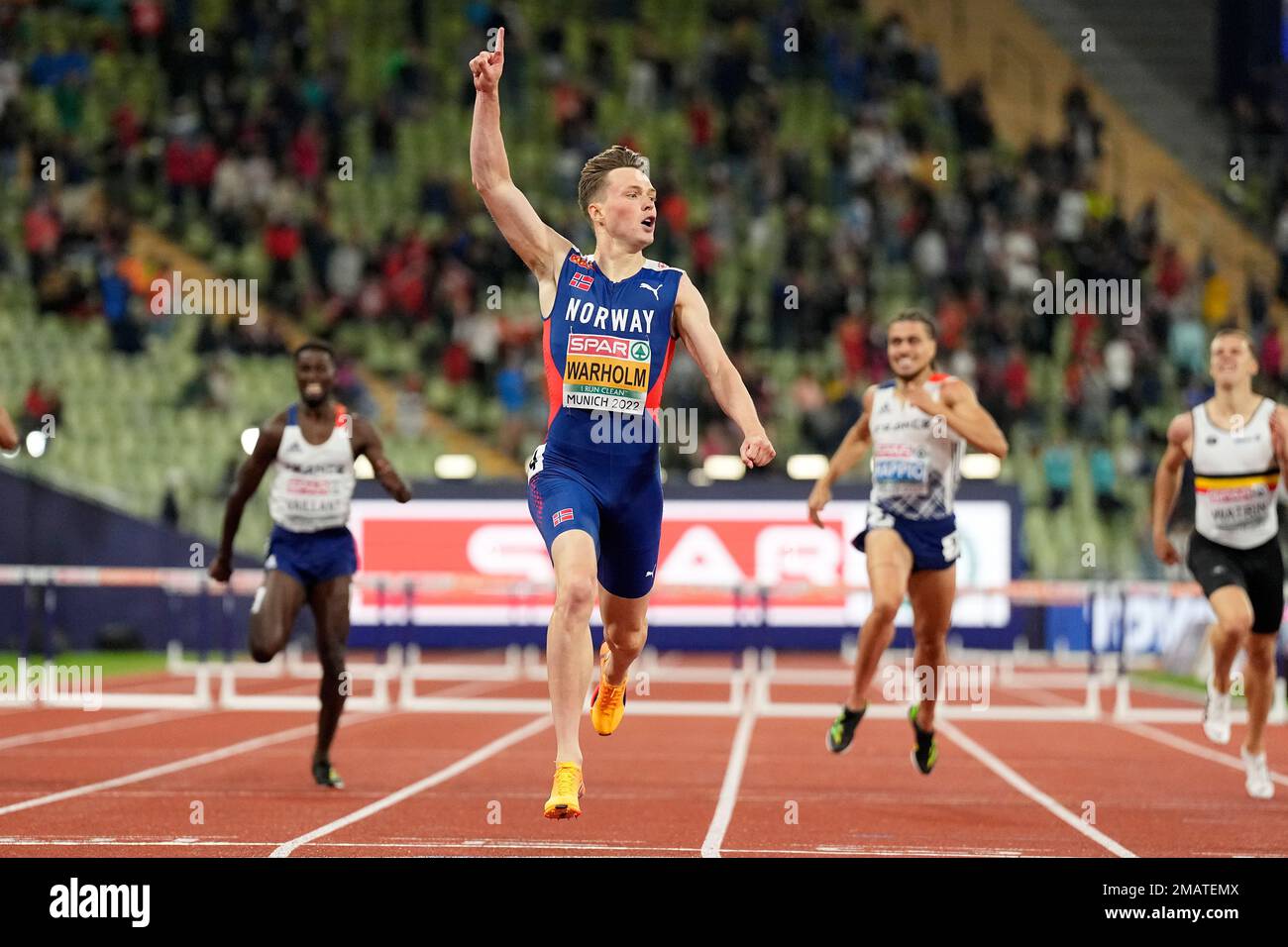Karsten Warholm, of Norway, celebrates after winning the gold medal in ...