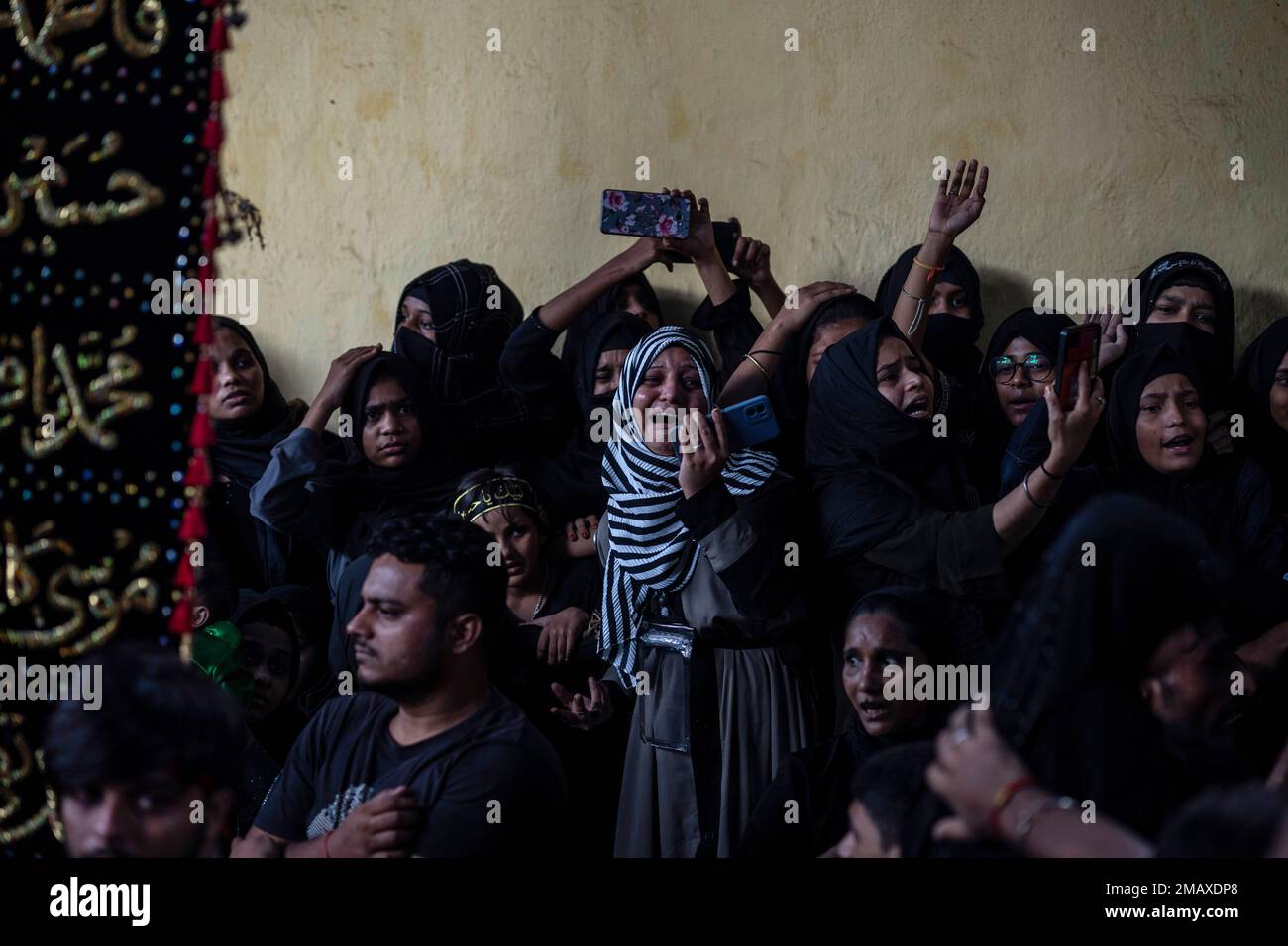 Shiite Muslims take part in an Ashoura procession in Mumbai, India ...