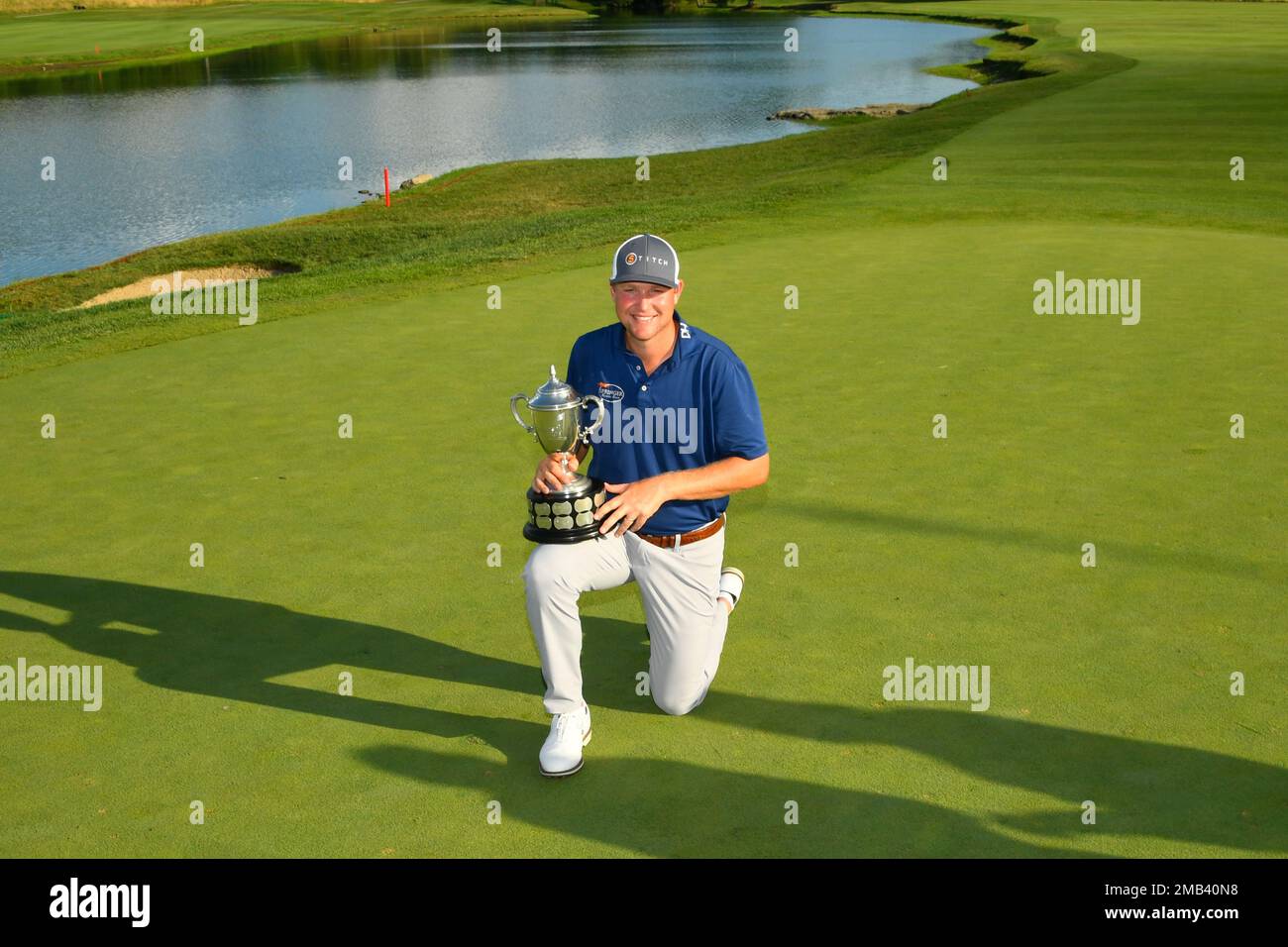 Trey Mullinax holds the trophy after winning the Barbasol Championship
