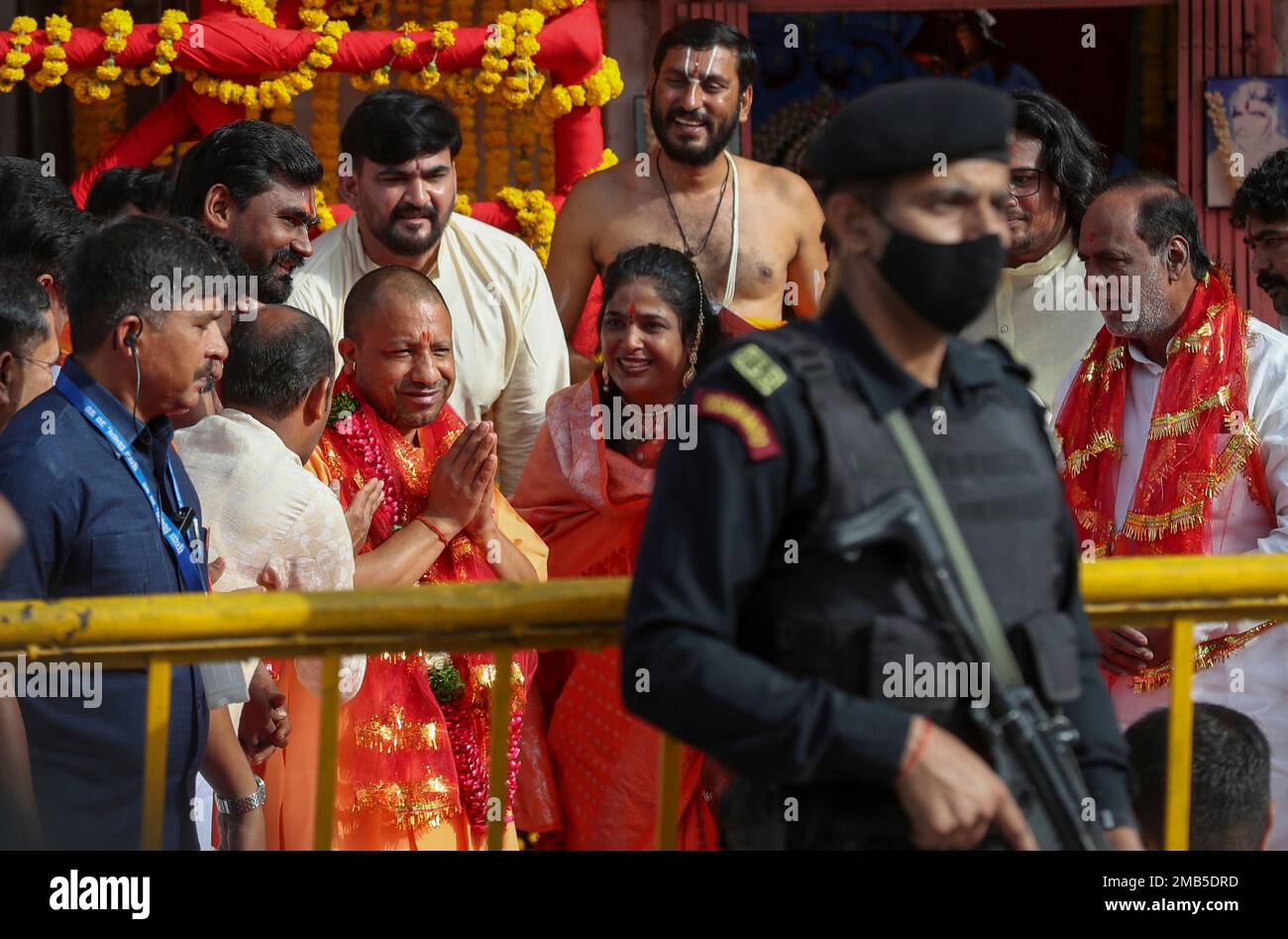 Uttar Pradesh Chief Minister Yogi Adityanath, center left, greets as he ...