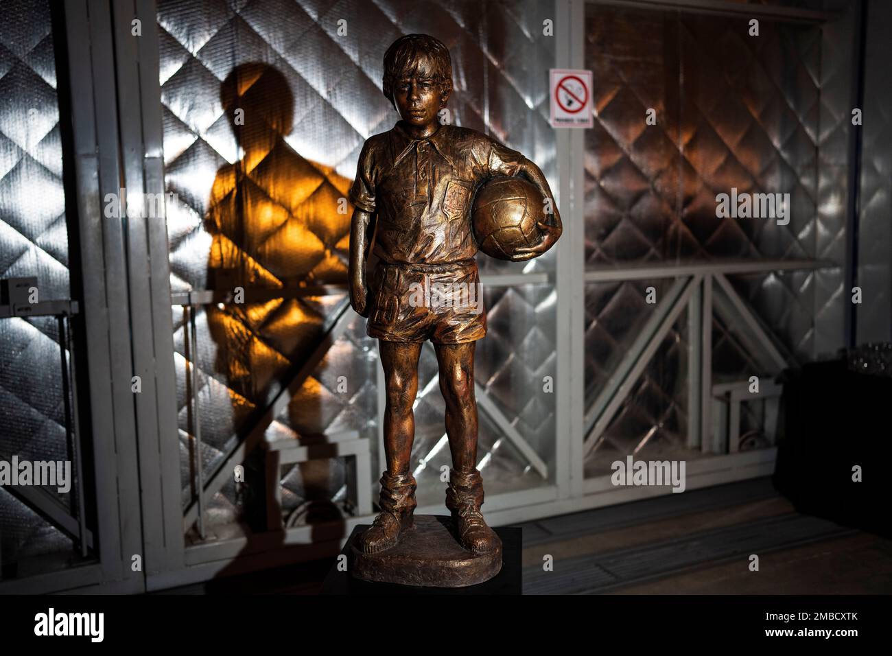 A statue of the late football star Diego Maradona as a youth is