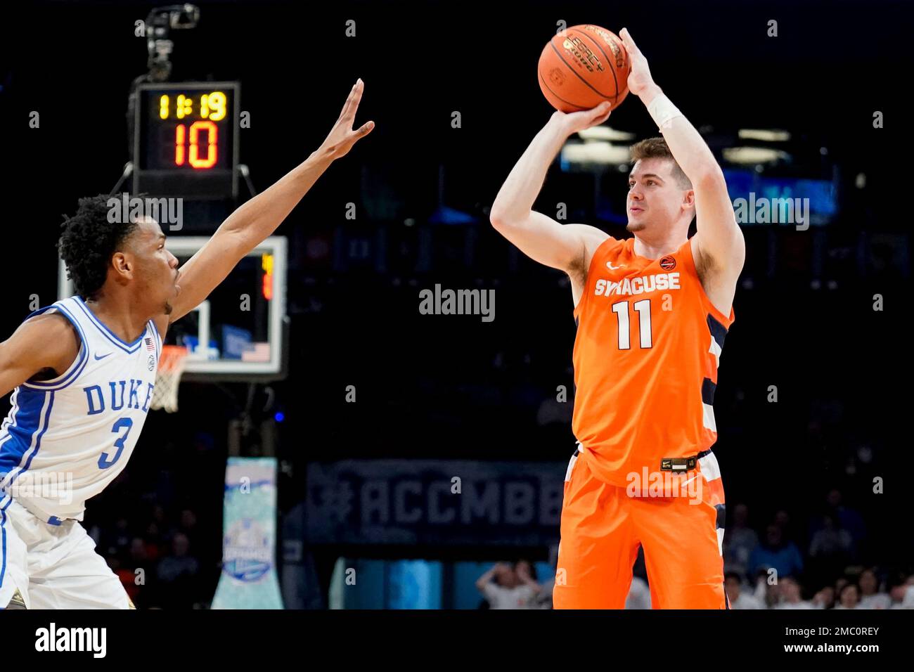 Syracuse's Joseph Girard III (11) shoots against Duke's Jeremy Roach (3
