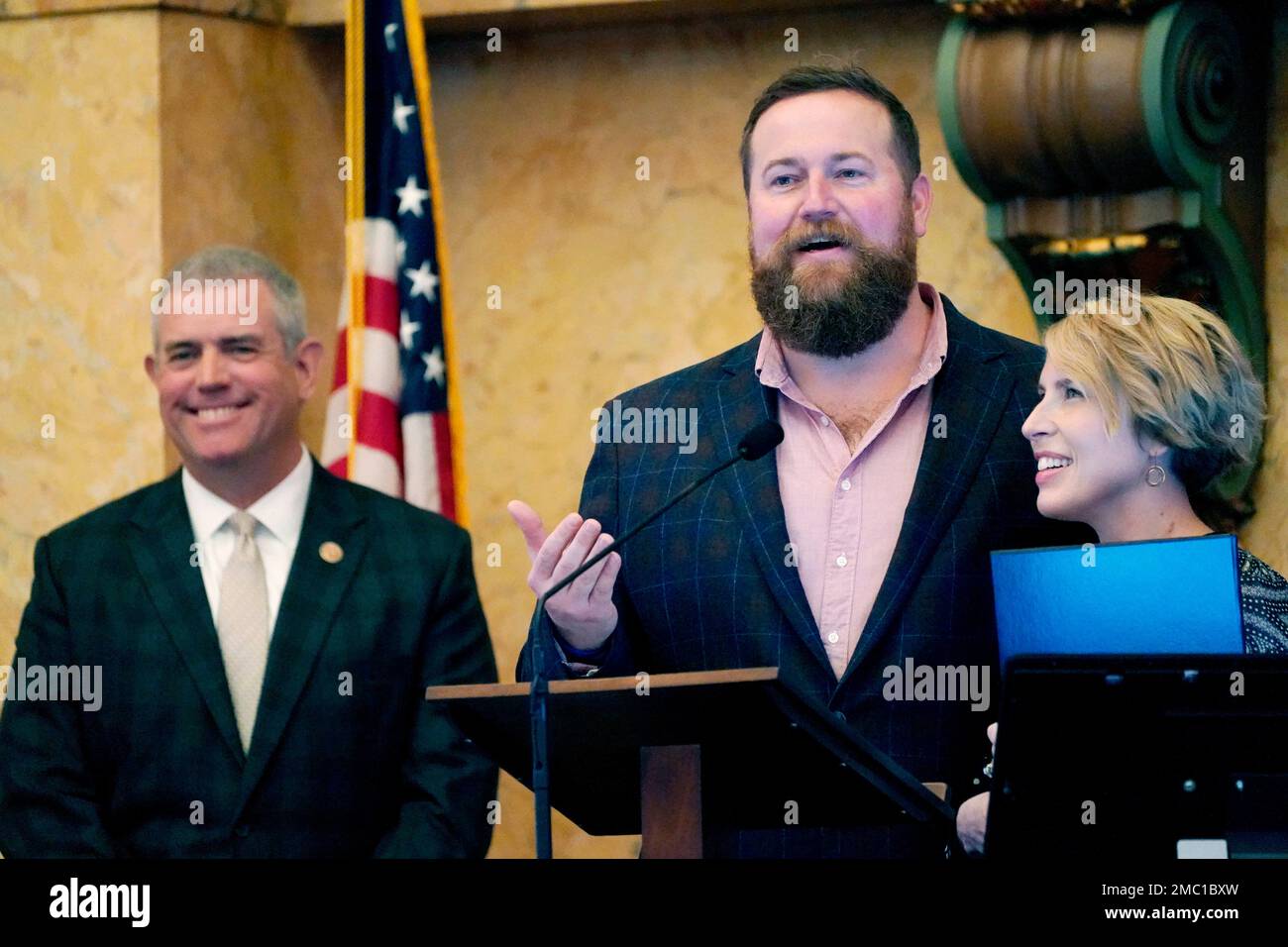 Mississippi House Speaker Philip Gunn, RClinton, left, laughs as "Home Town" hosts Ben Napier