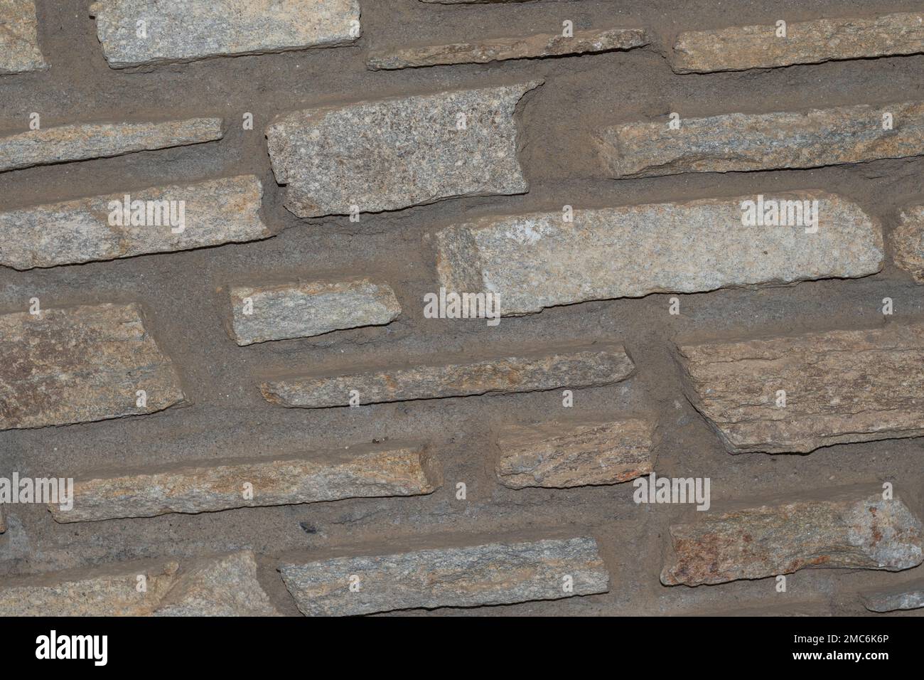 Rustikaler und gealterter Wandstein, Außenwand Stockfoto