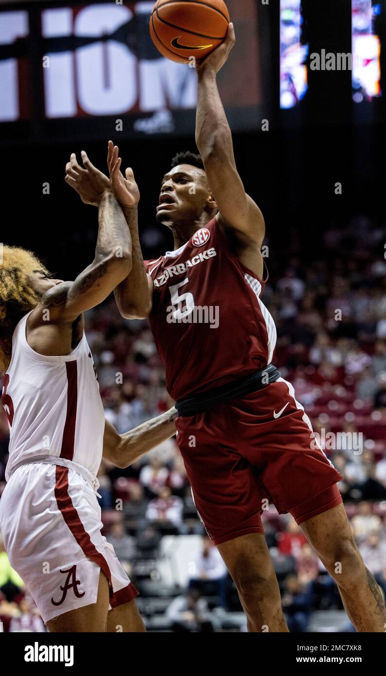 Arkansas guard Au'Diese Toney (5) shoots over Alabama guard JD Davison