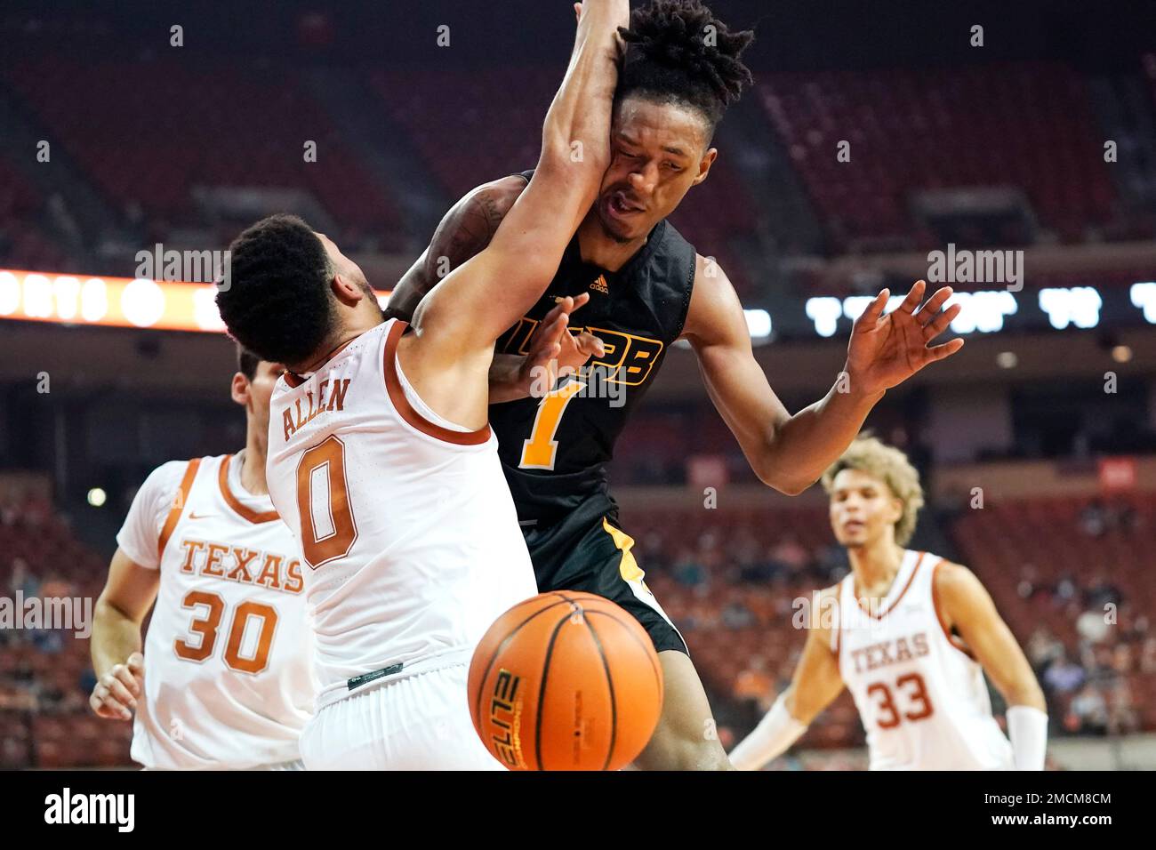 ArkansasPine Bluff guard Kylen Milton (1) is fouled by Texas forward