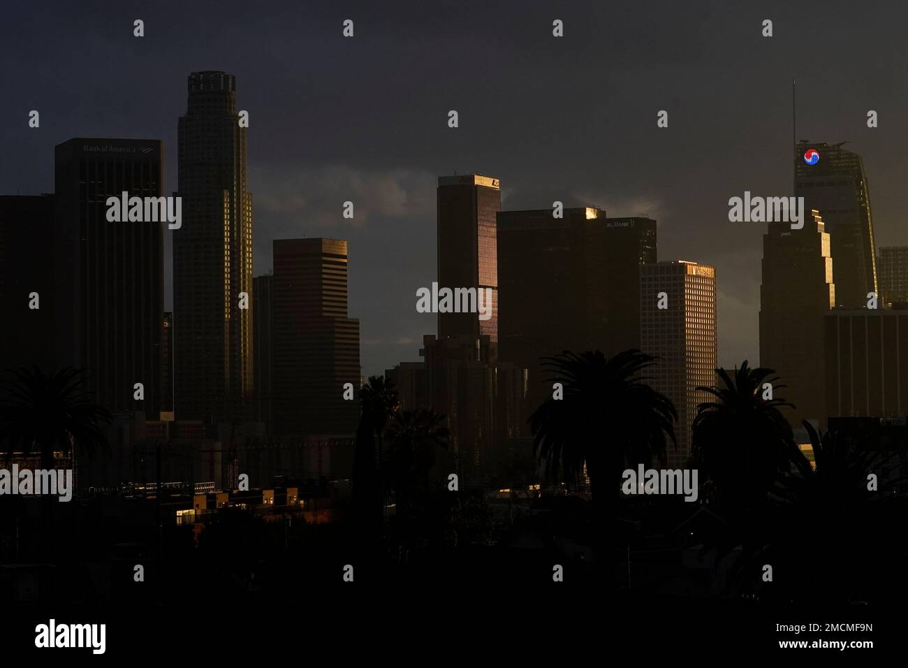 Heavy clouds move over downtown Los Angeles, Monday, Dec. 13, 2021. The ...