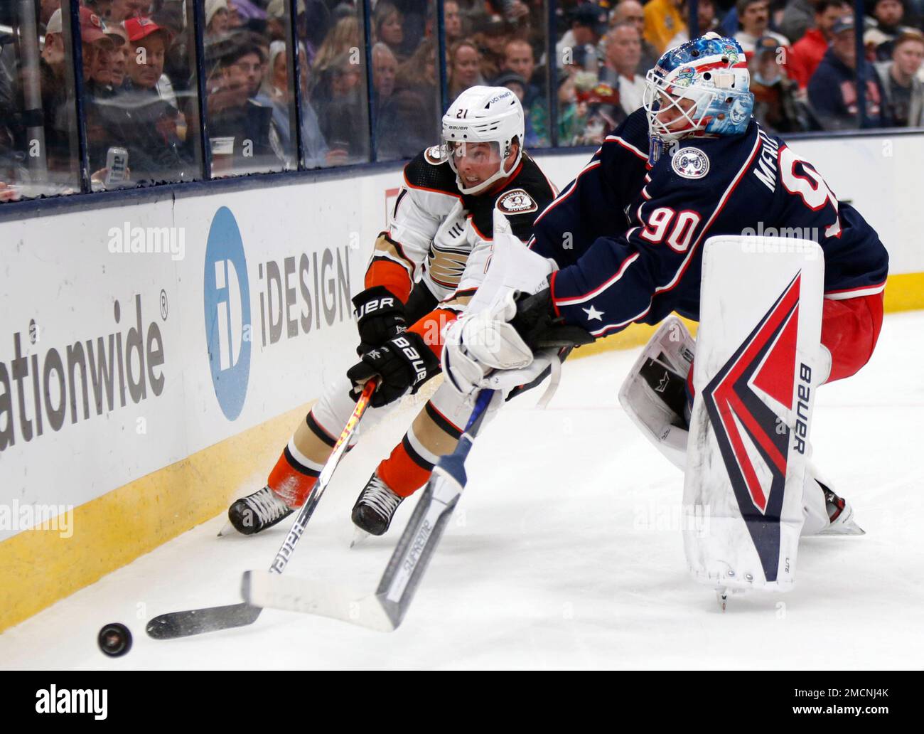 Anaheim Ducks Forward Isac Lundestrom, Left, Reaches For The Puck Next ...