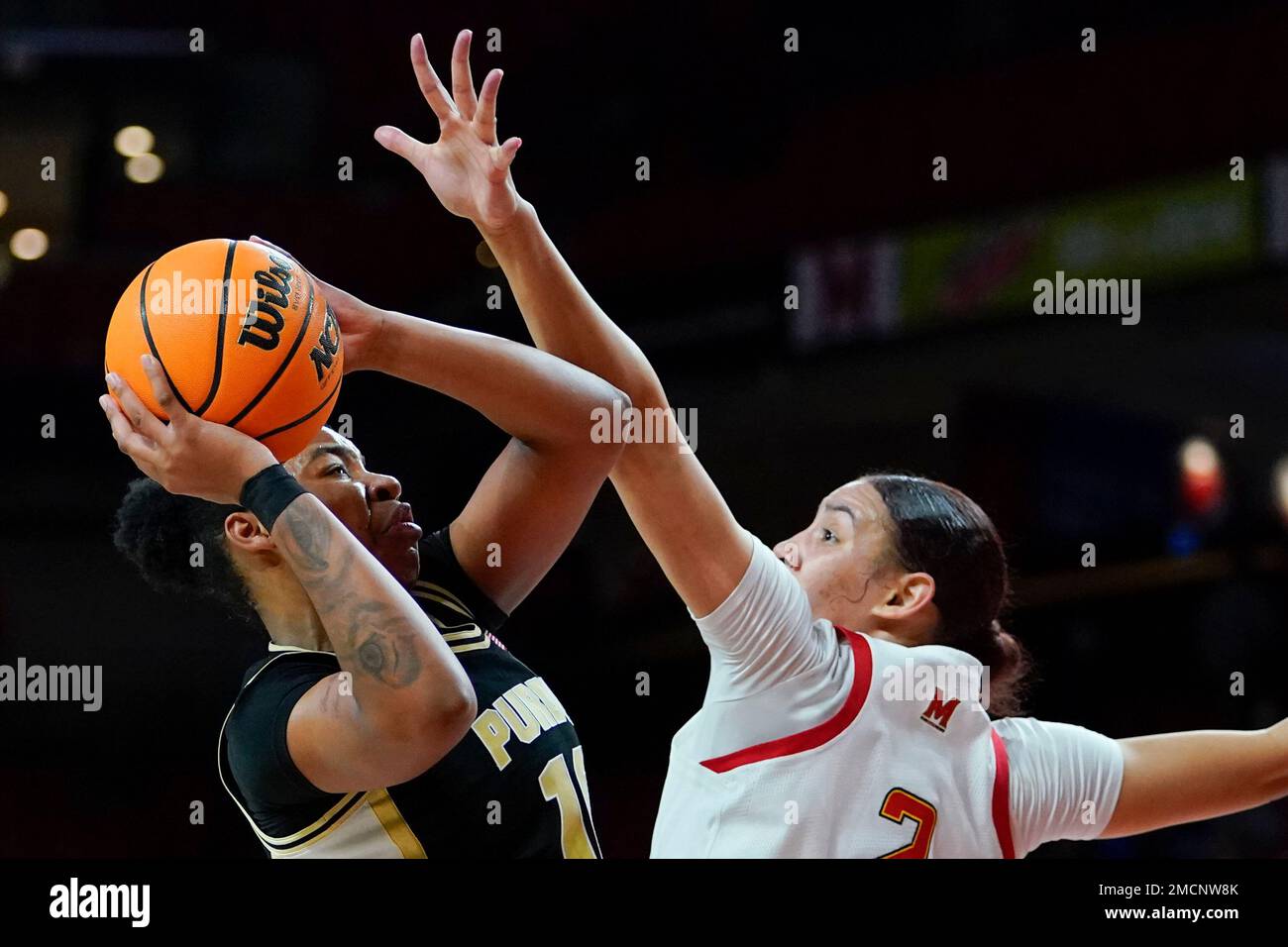 Purdue guard Jeanae Terry, left, shoots aginst Maryland forward Mimi ...