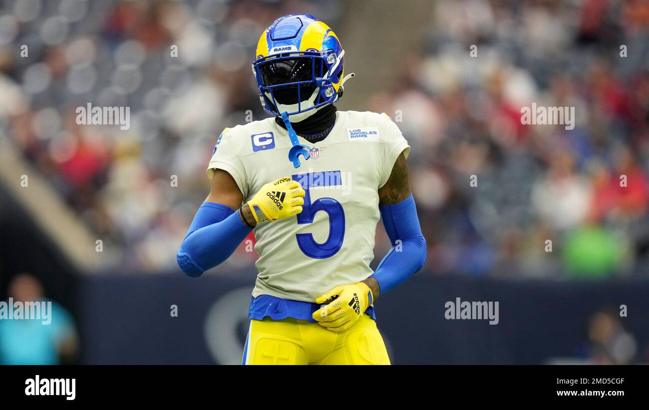 Seattle Seahawks wide receiver Laquon Treadwell (18) catches a pass and is  tackled by Los Angeles Rams' Jalen Ramsey (5) in an NFL football game,  Sunday, Dec. 4, 2022, in Inglewood, Calif.