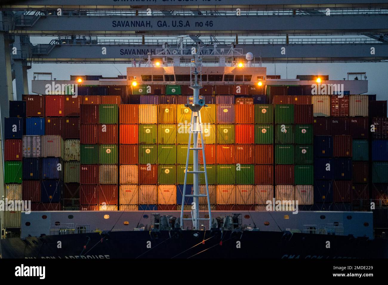 Ship to shore cranes work the container ship CMA CGM Laperouse at the ...