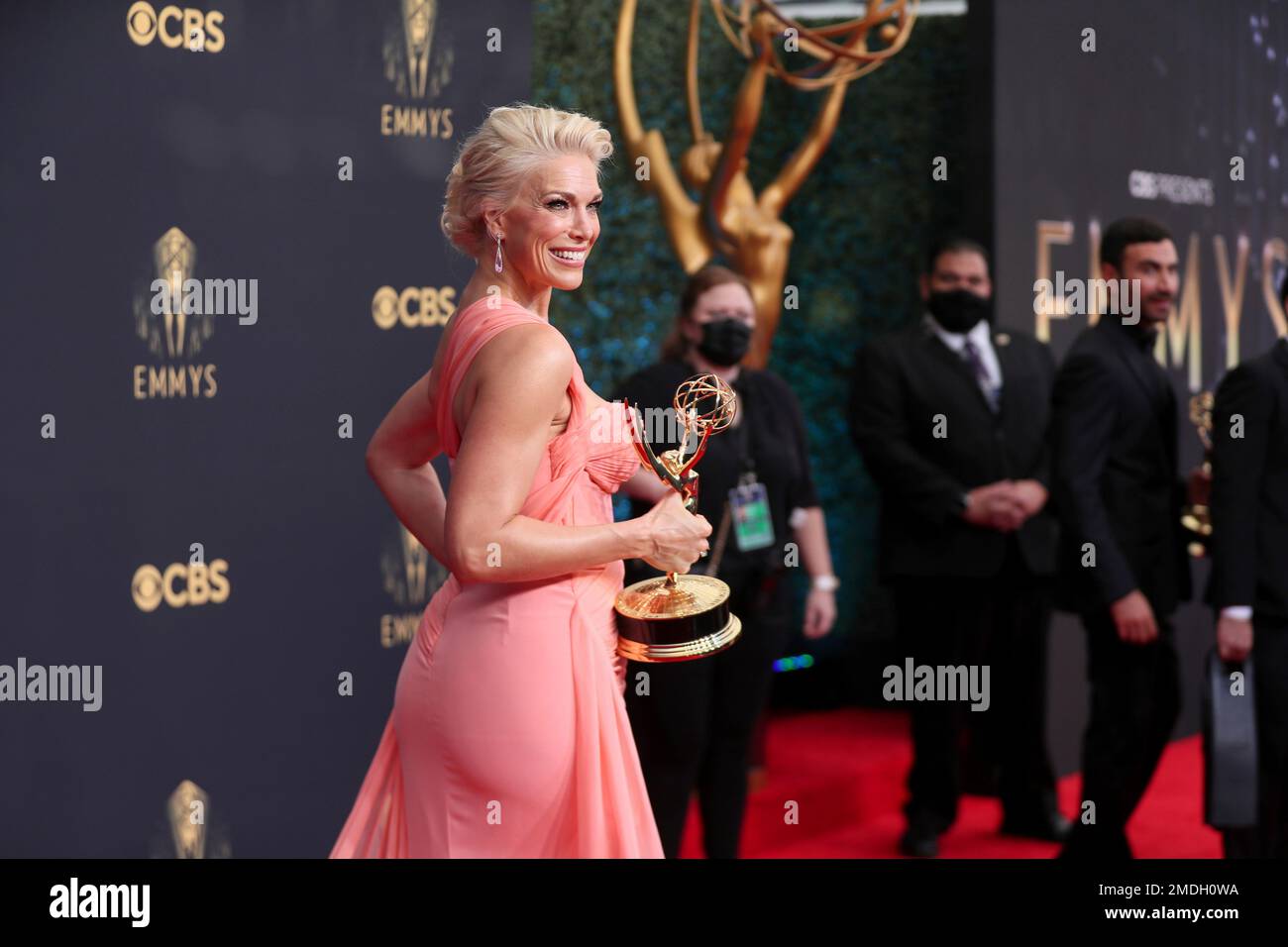 Hannah Waddingham poses for a photo with the award for outstanding