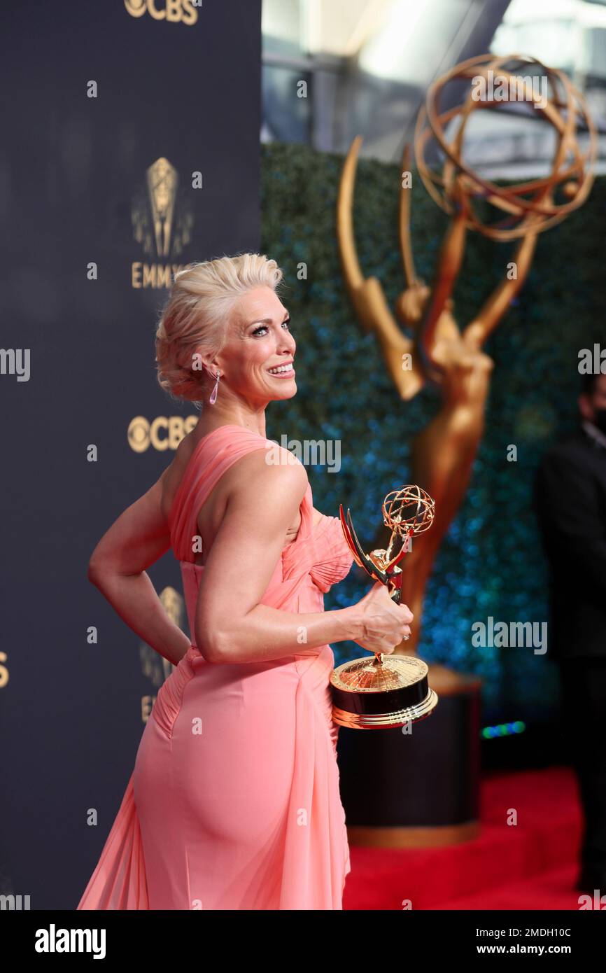 Hannah Waddingham poses for a photo with the award for outstanding