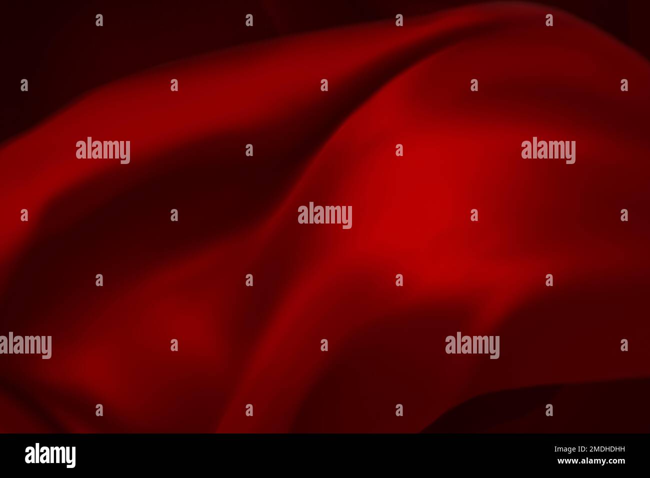 Die Textur aus roter Seide oder Satin kann als abstrakter Hintergrund, als abstrakter Hintergrund oder als flüssige Welle oder wellenförmige Falten verwendet werden Stockfoto