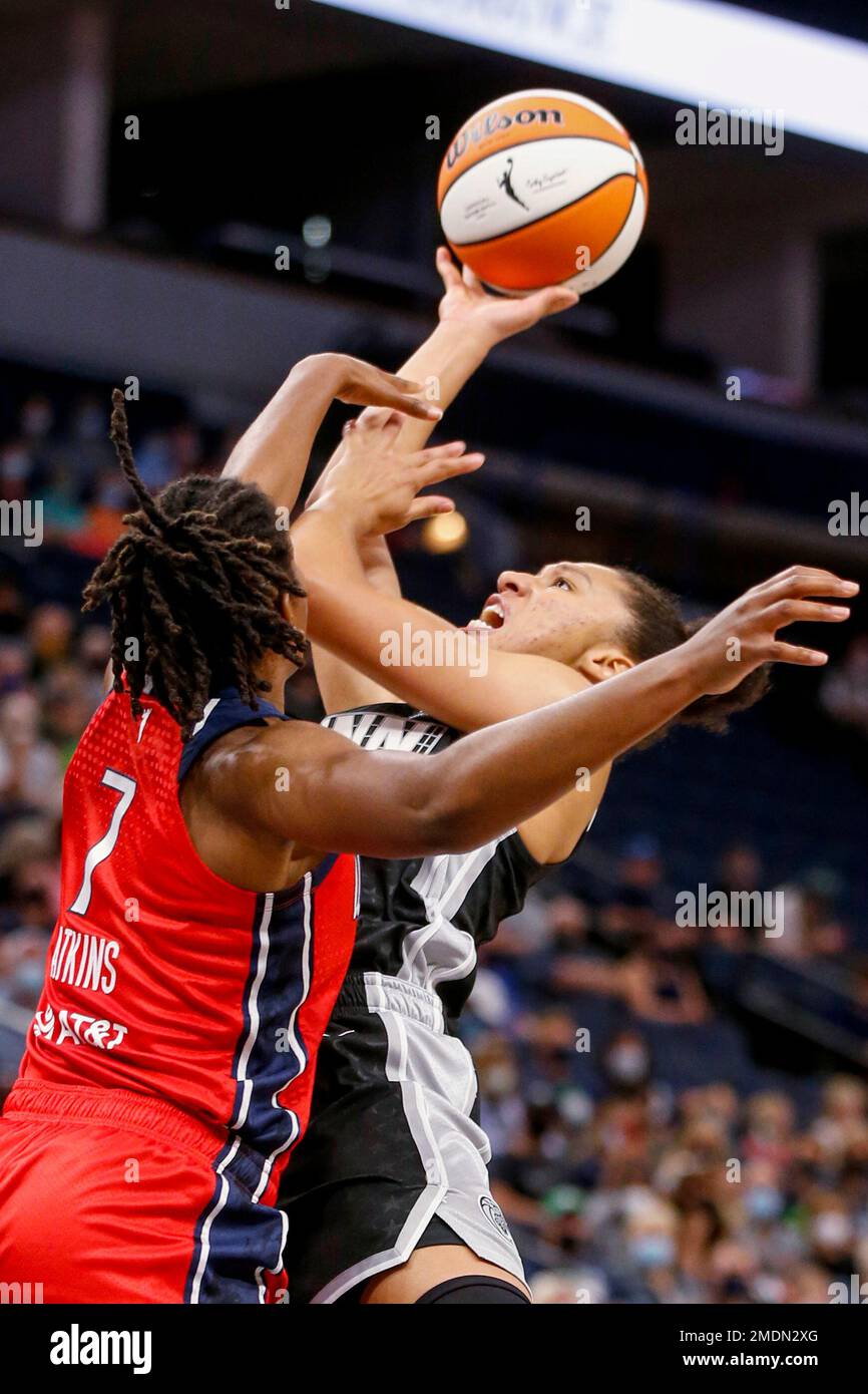 Minnesota Lynx guard Aerial Powers (3) shoots over Washington Mystics guard Ariel Atkins (7) in the first quarter of a WNBA basketball game Saturday, Sept. 4, 2021, in Minneapolis. (AP Photo/Bruce Kluckhohn) Stockfoto