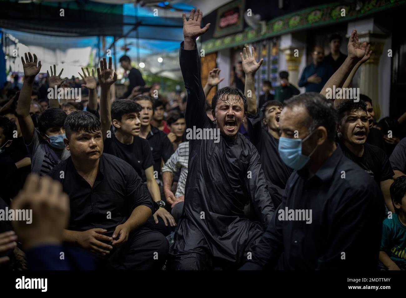 Afghan Shiite Muslim refugees living in India shout religious slogans ...
