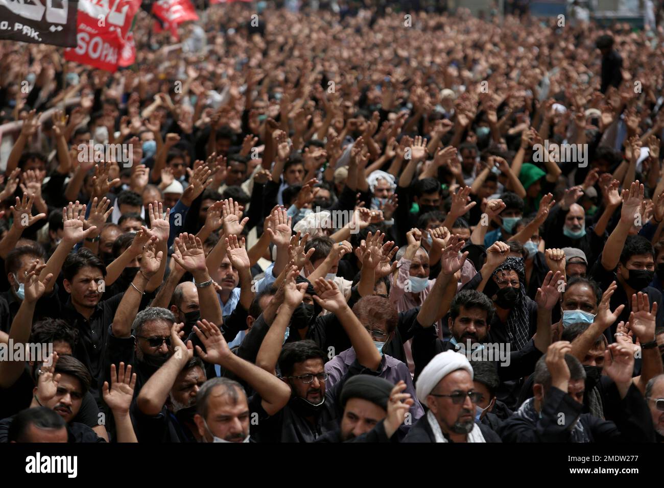 Shiite Muslims chant religious slogans during a procession to mark ...