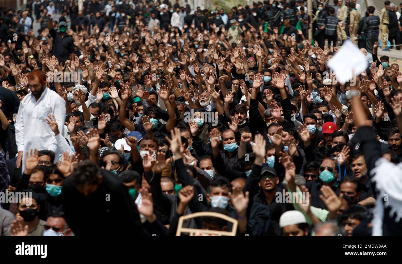 Shiite Muslims chant religious slogans during a Muharram procession, in ...