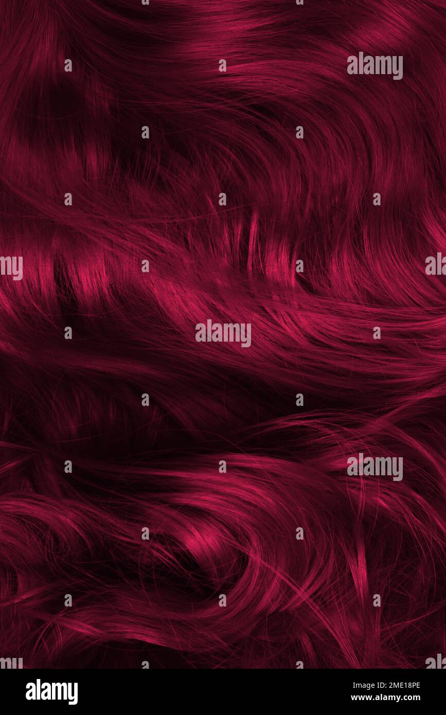 Viva-Haar-Hintergrund Magenta. Lockiges rotes Haar. Stockfoto