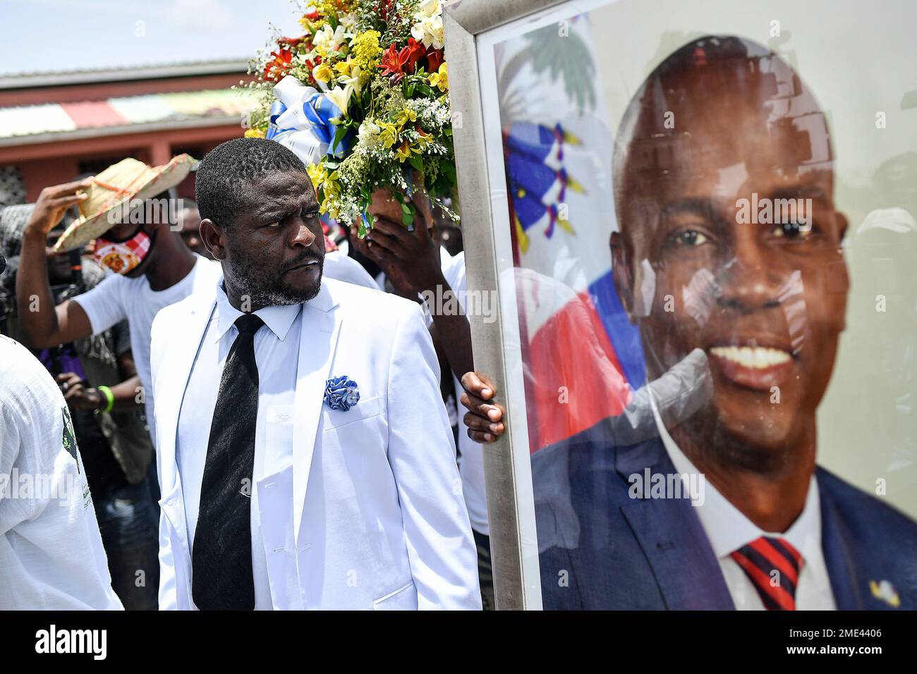 Jimmy Cherizier, alias Barbecue, a former police officer who heads a gang  coalition known as "G9 Family and Allies," leads a march to demand justice  for slain Haitian President Jovenel Moise in