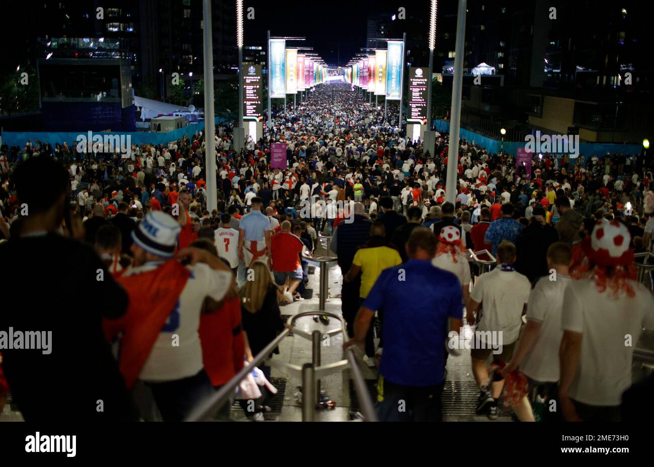 Supporters leave Wembley Stadium in London, Sunday, July 11, 2021, after Italy won the Euro 2020 soccer championship final match between England and Italy. (AP Photo/David Cliff) Stockfoto