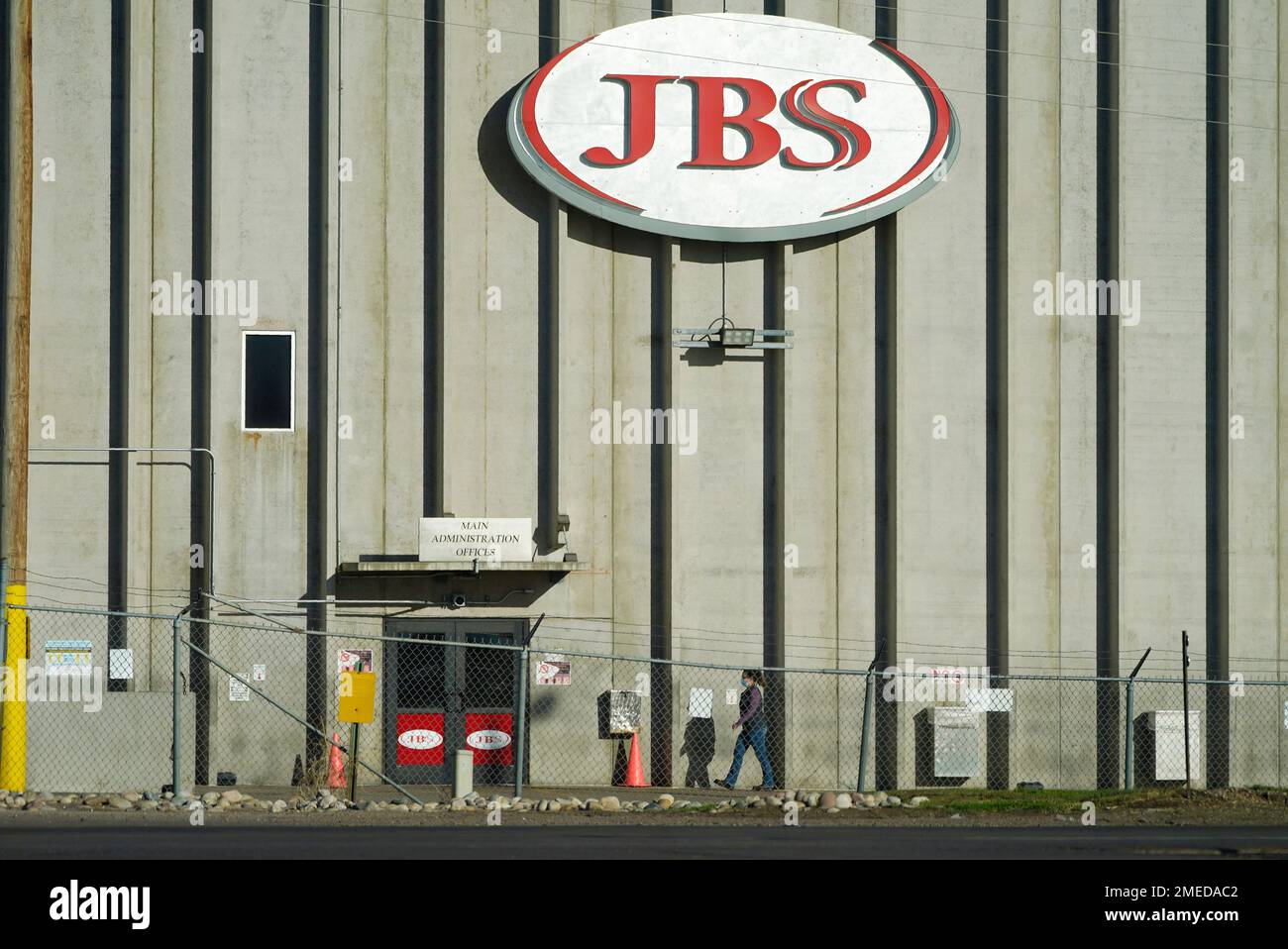 FILE In this Oct. 12, 2020 file photo, a worker heads into the JBS