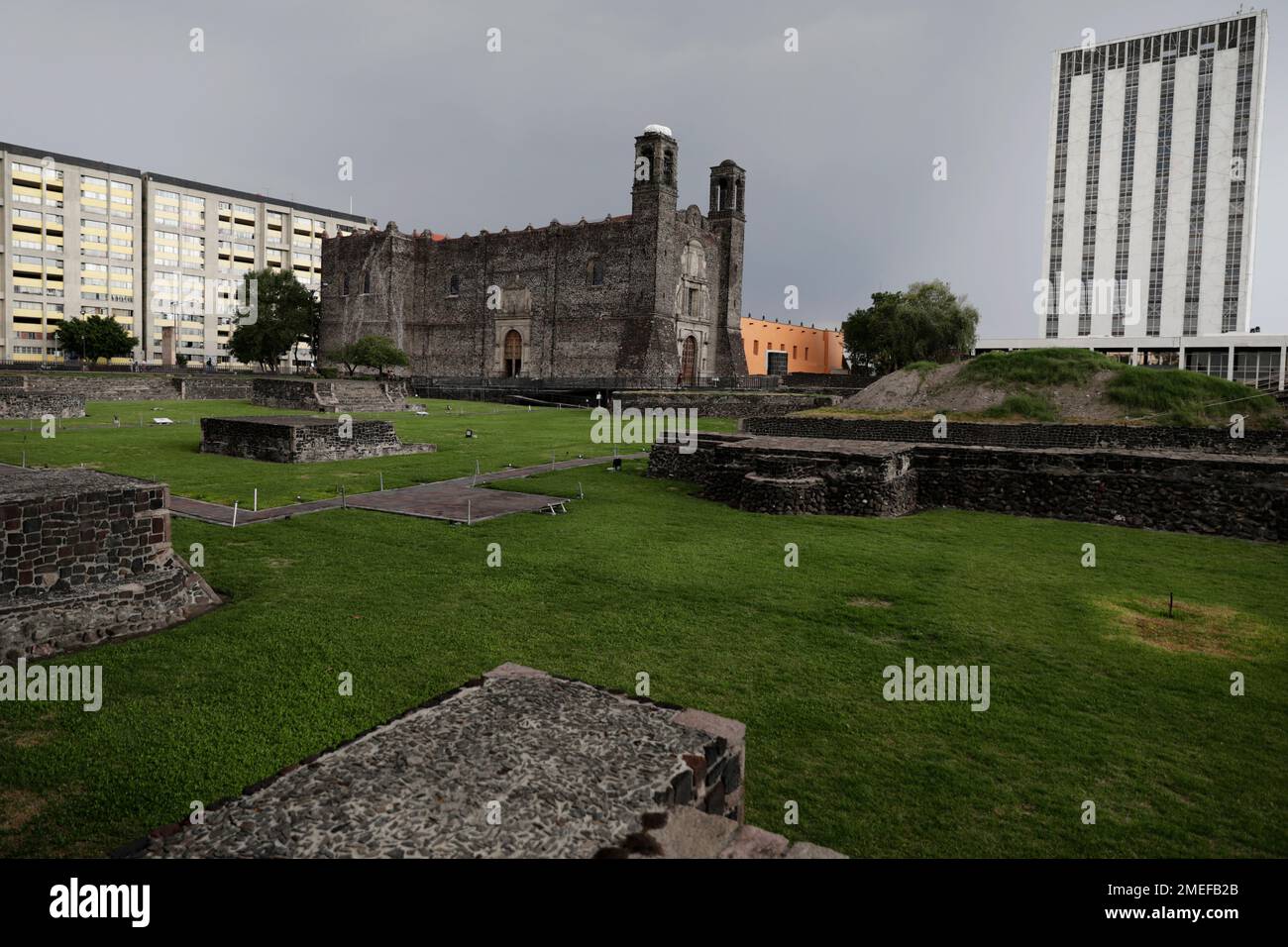 An ancient Aztec temple, foreground, a Spanish colonial church, top ...