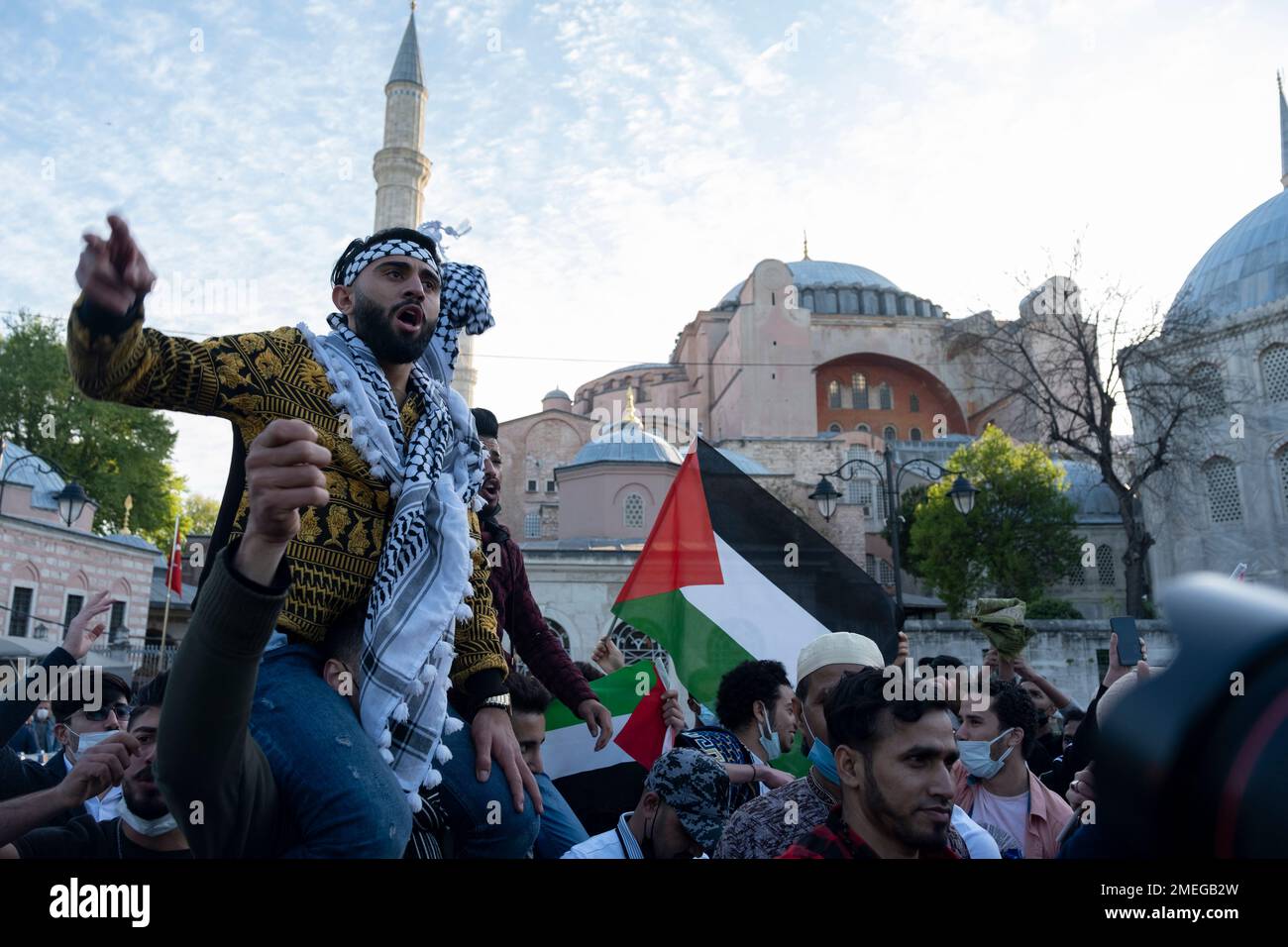 Protesters, some holding Palestinian flags chant anti-Israel slogans ...
