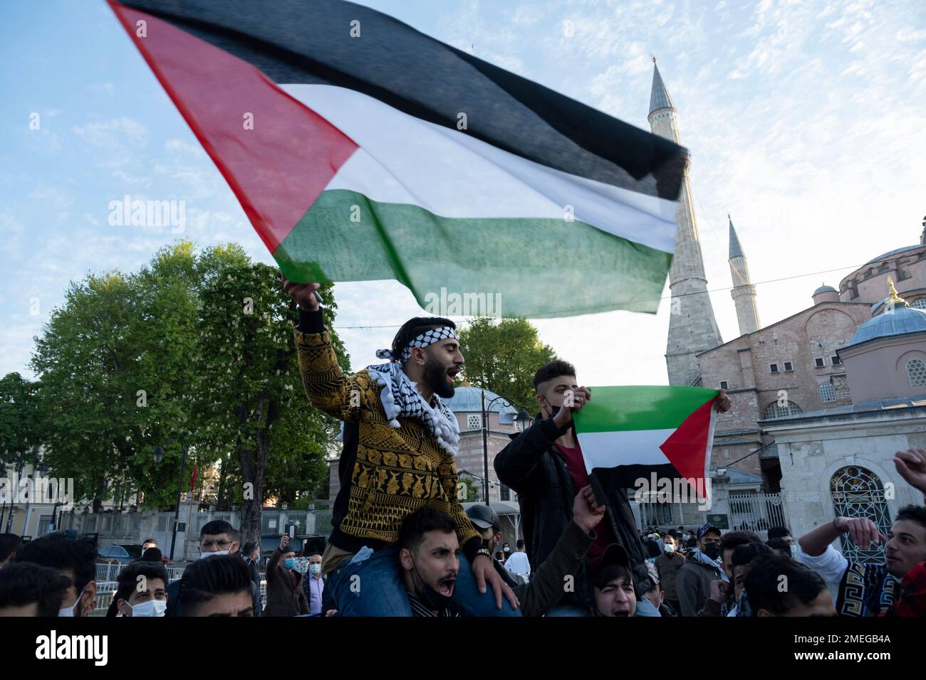 Protesters, some holding Palestinian flags chant anti-Israel slogans ...