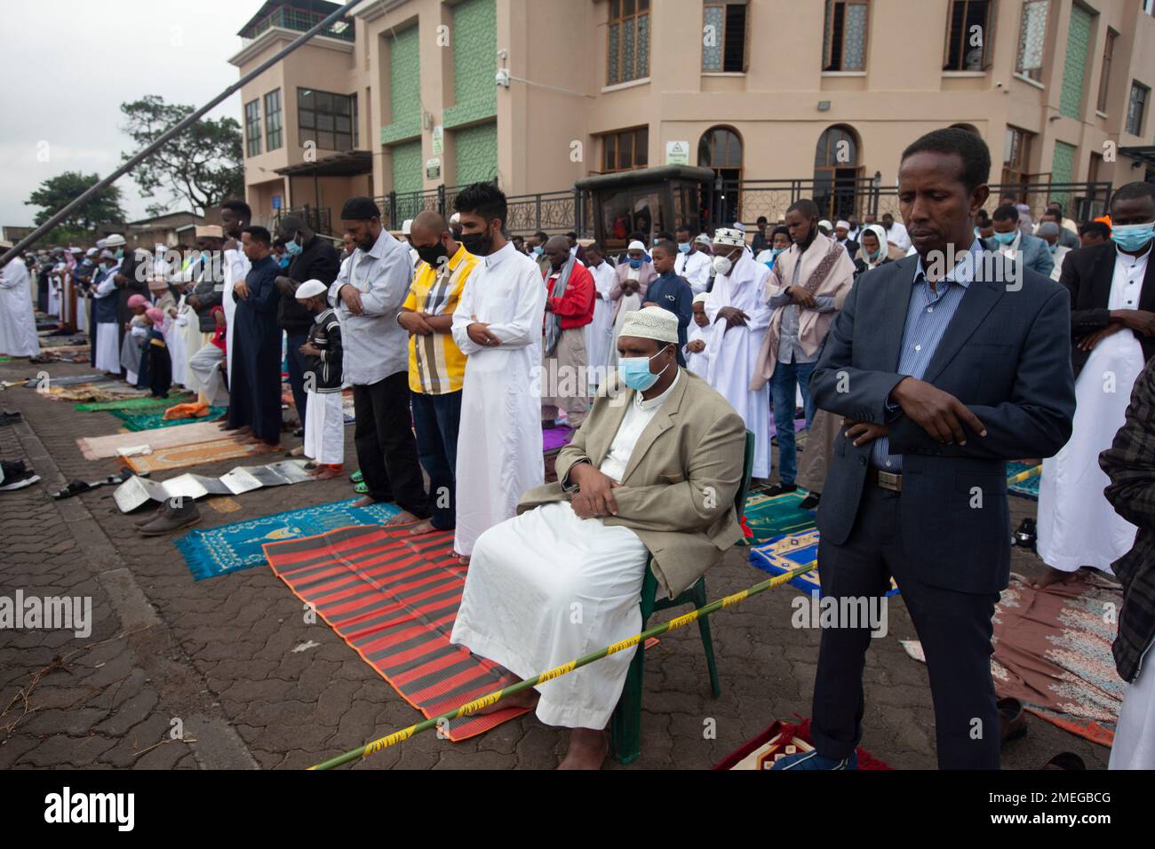 Kenyan Muslims stand for prayers for Eid alFitr to mark the end of