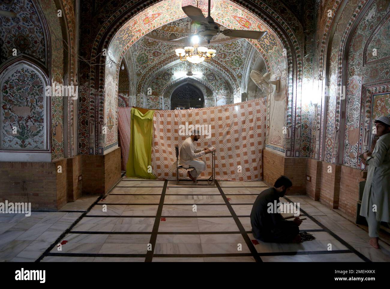 Mohbat Muslim worshippers recite passages from the Quran while they observe ...
