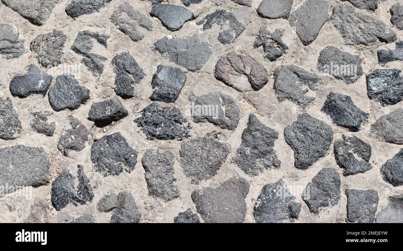 Kopfsteinpflastertextur als Hintergrund. Stockfoto