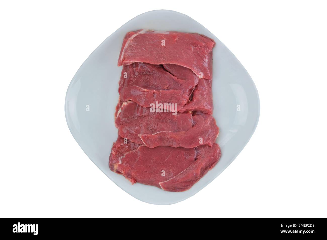 Rindersteaks in Platte, isoliert auf weißem Hintergrund. Rohes Fleisch zum Kochen. Draufsicht. Stockfoto