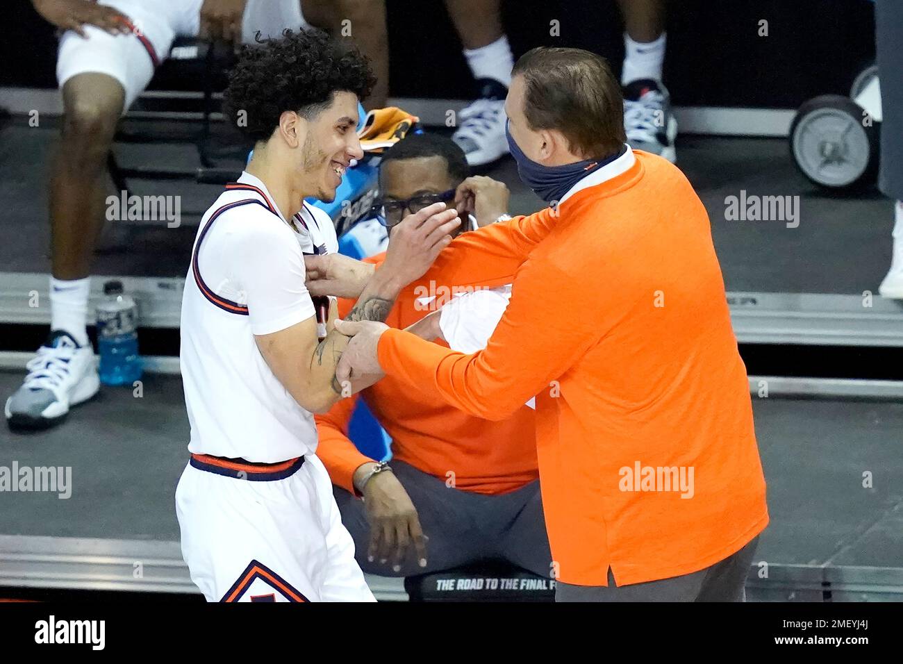 Illinois guard Andre Curbelo, left, celebrates with head coach Brad