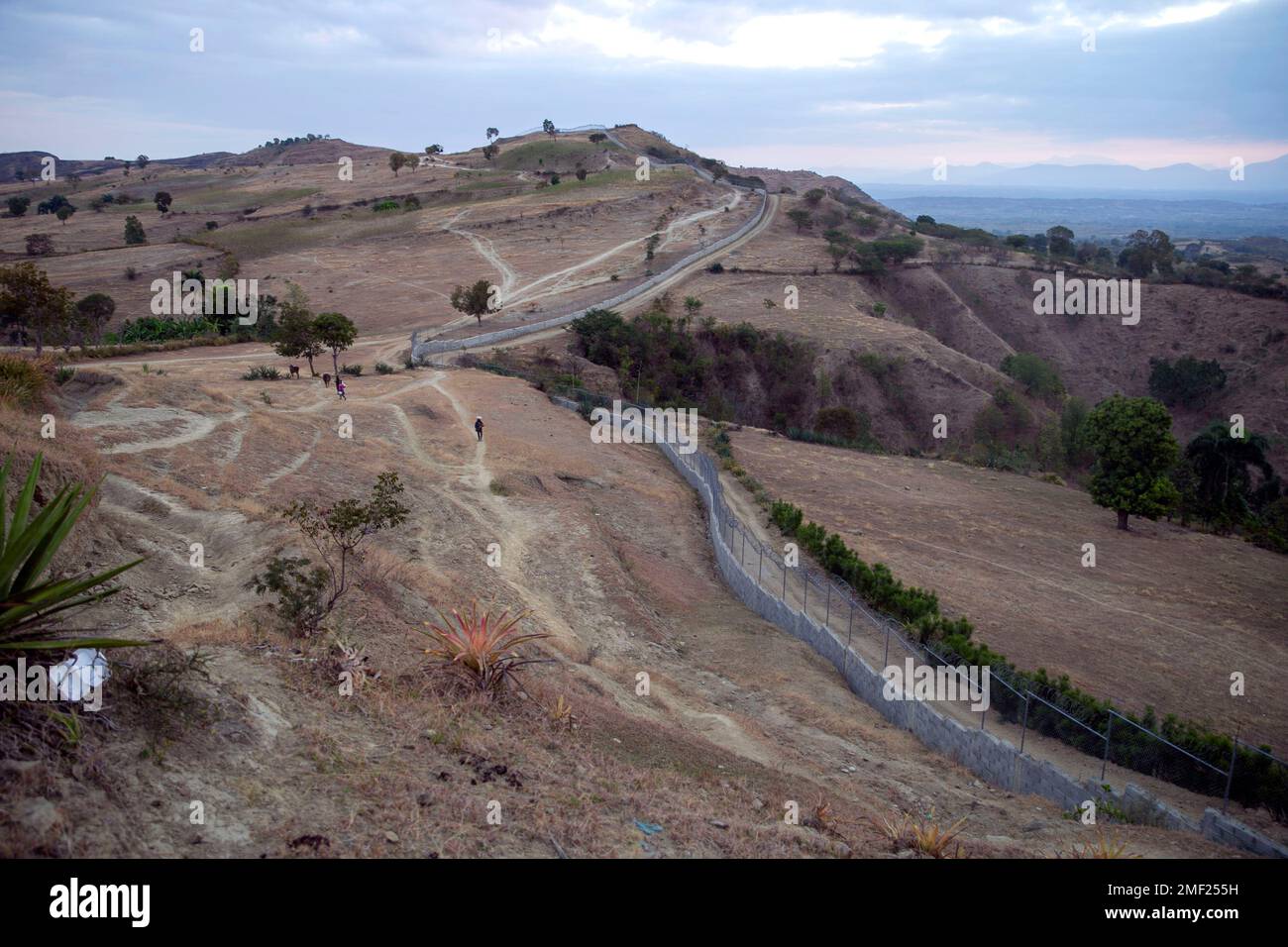 A man walks along a foot path in Belladere, Haiti, on the border with ...